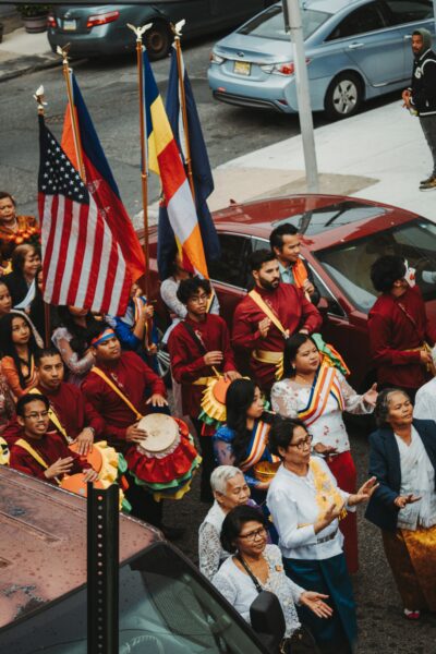 Group of people marching with flags.