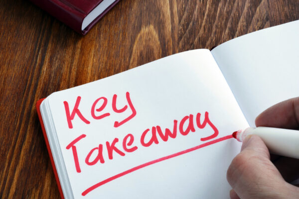 The phrase 'Key takeaway' written in a notebook
