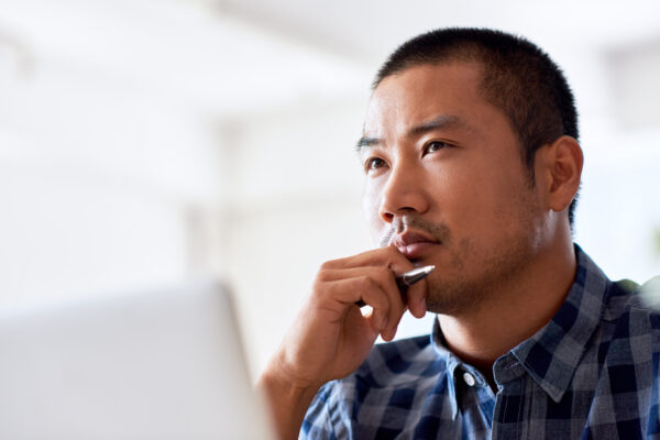 Man in business attire with a thoughtful expression